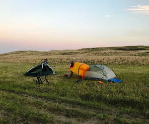 Students setting up camping tents