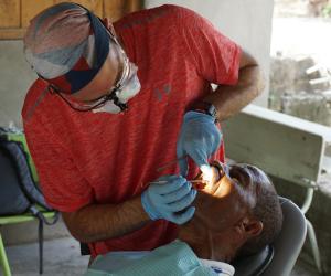 Dentist working on patient's teeth