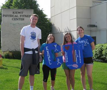 Students in the EXSEL organization showing off their CU spirit