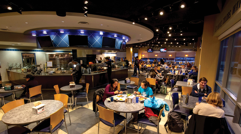 Students at lunch time eating in the dining area.