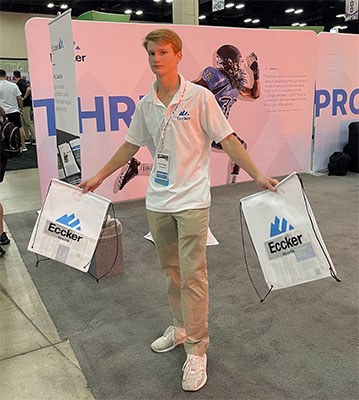 Tyler Langford markets his company business at exhibition event.