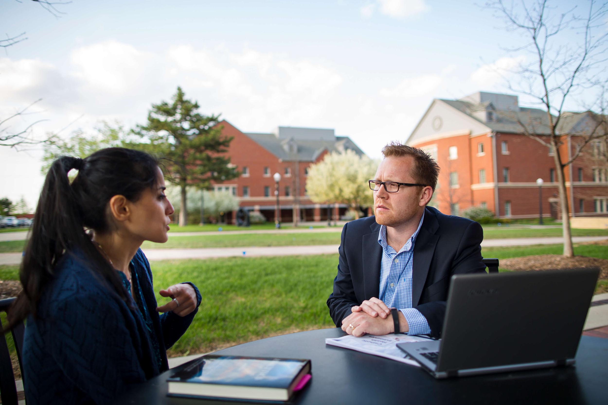 Student and professor meeting on campus