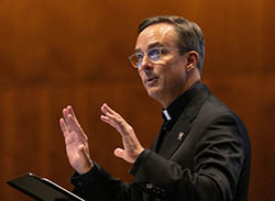 Daniel Hendrickson speaking to audience
