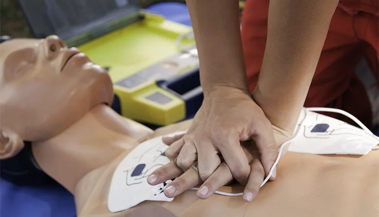 Chest compressions and AED on manikin