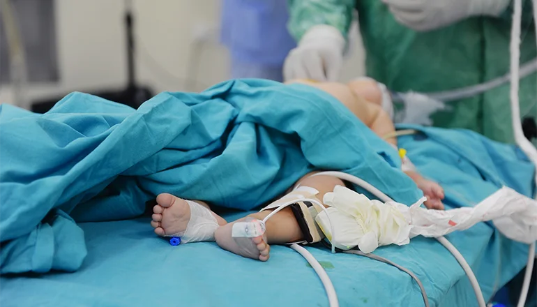 Baby with medical professional in emergency department