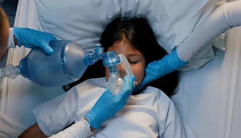 Pediatric patient receiving oxygen