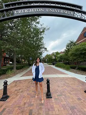 Ayushi Kaul on Omaha campus mallway.