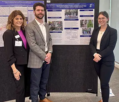 Trotter presents her research paper in poster session.