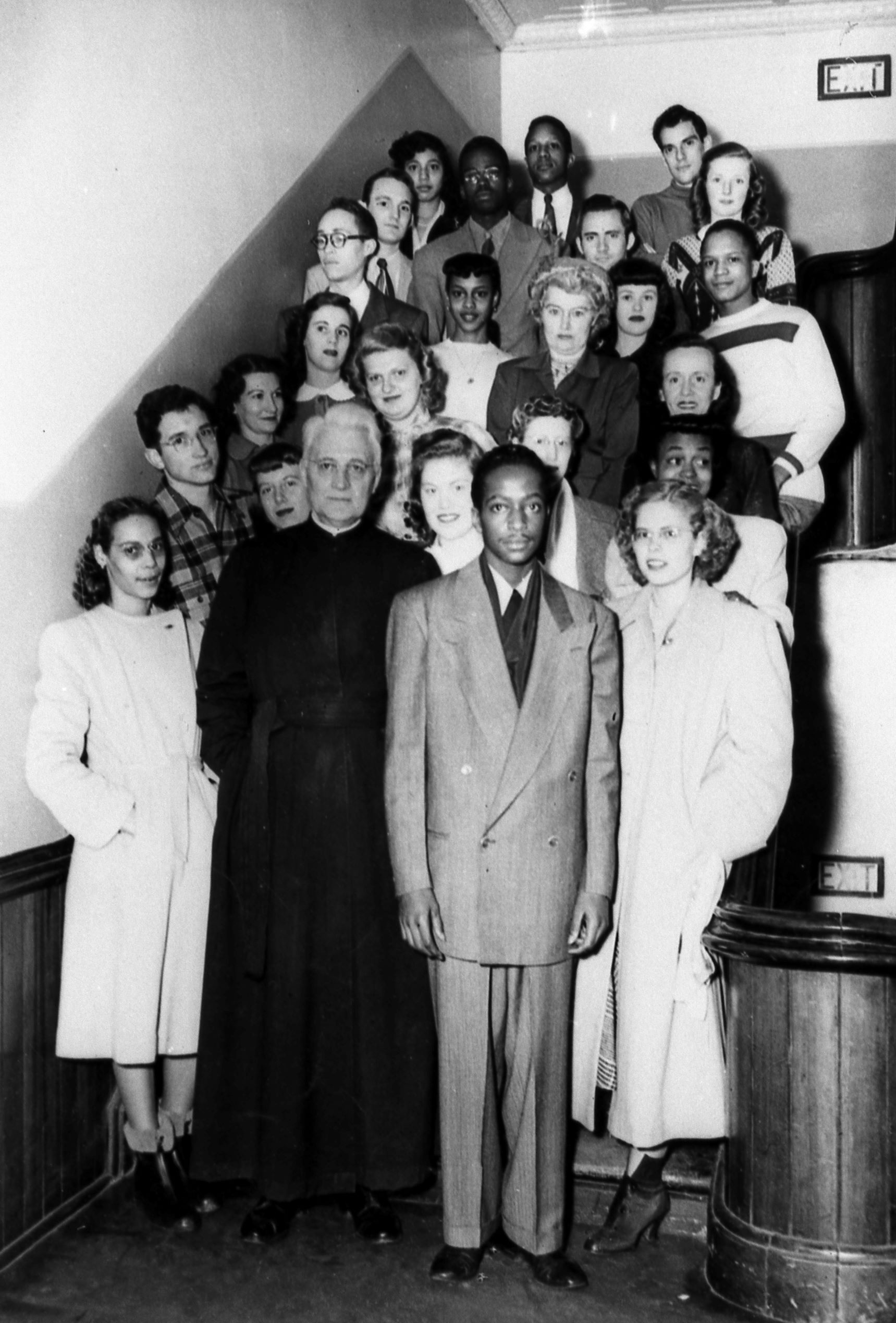 Members of the Omaha DePorres Club standing on the stairs in Creighton Hall circa 1948.