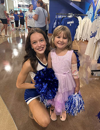Everleigh with Creighton dance team member.