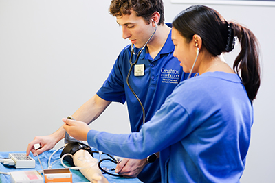 Students practicing clinical care.