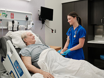 Nurse providing care to patient.
