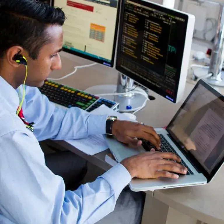 A man analyzing code on a laptop screen