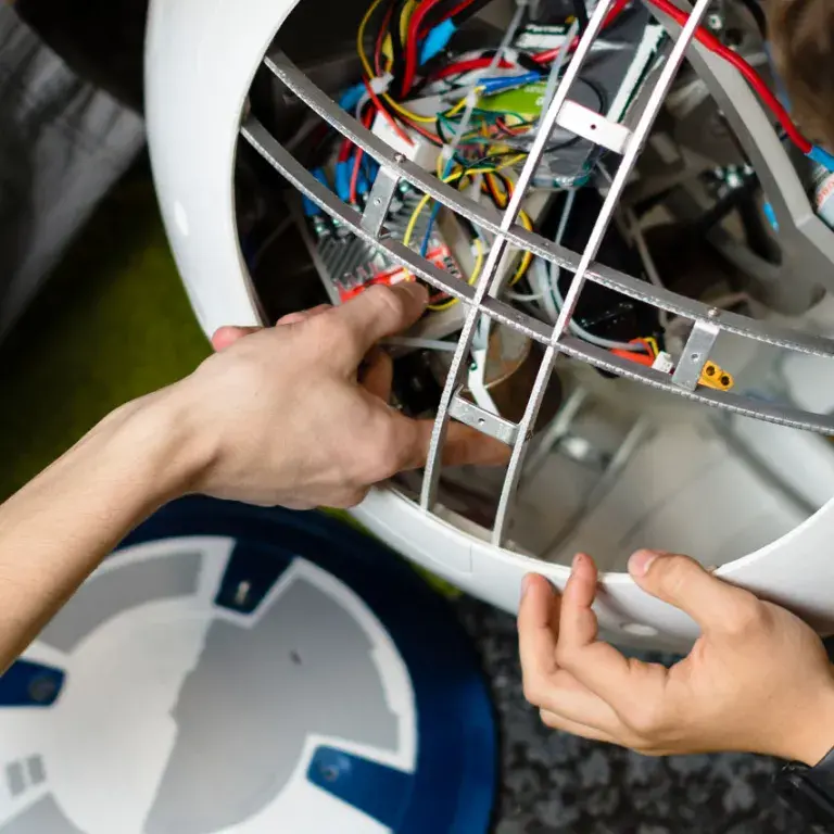 Students working on robotic device