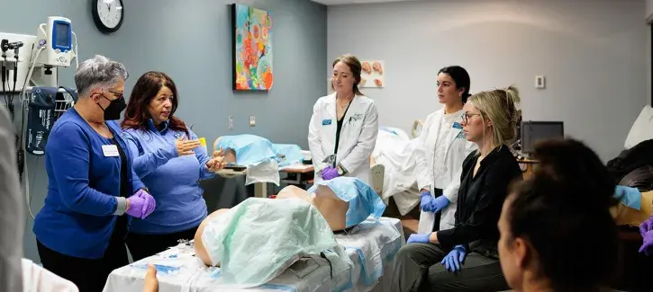 Nuring students and instructor in practial lab
