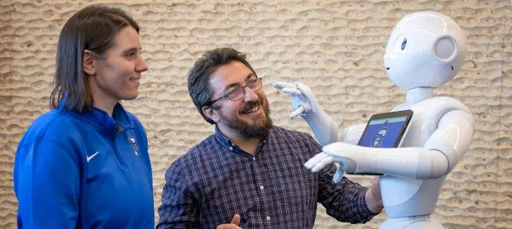 Natalie Gerhart and Ali Dag with Pepper Robot