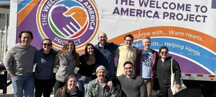 Service participants gathered around America Project truck.