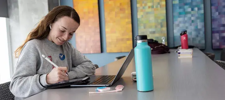 female student working on laptop