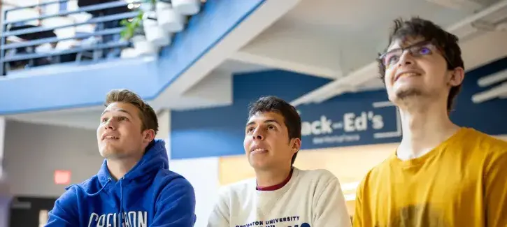 Students watching game on campus.