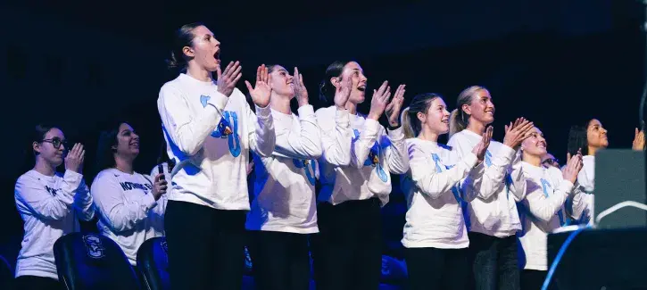 Creighton women's team cheer during bracket selection show.