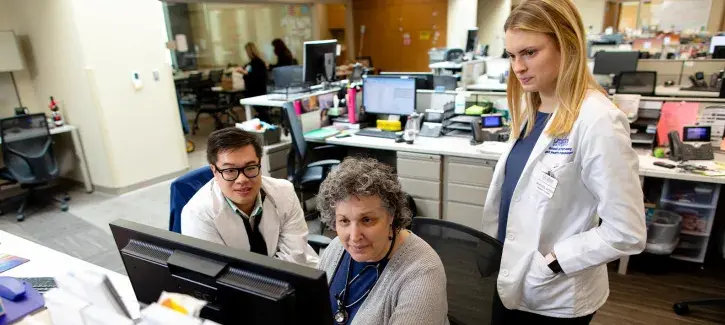 healt professionals at computer in office