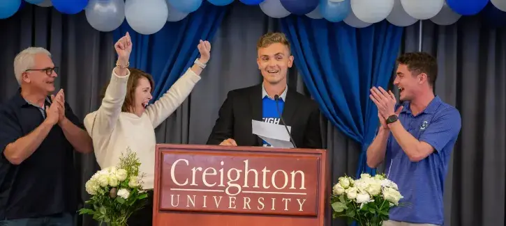 Match recipient celebrating at podium.