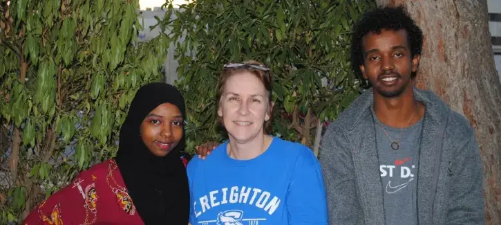 JWL student poses for picture with Creighton representative.