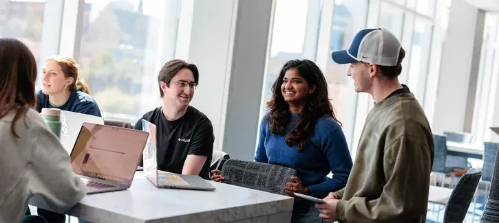 students socializing at a table