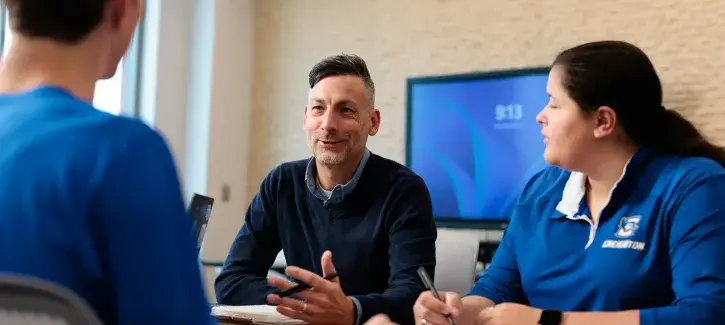 Nathan Preheim working with students