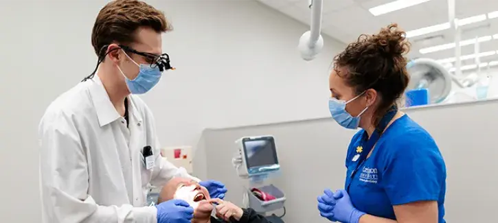 Dental student working in clinic