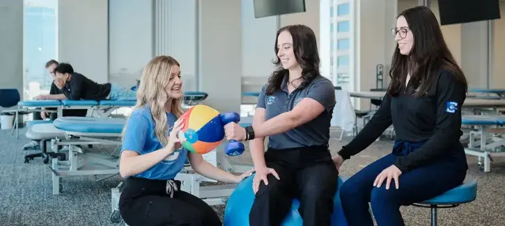 Occupational therapist working with to train students.