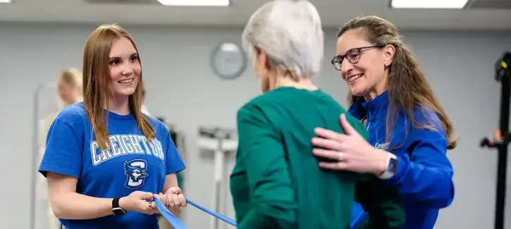 Occupational therapist works with patient.
