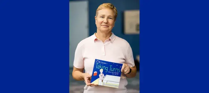 MK Czerwiec holding their book