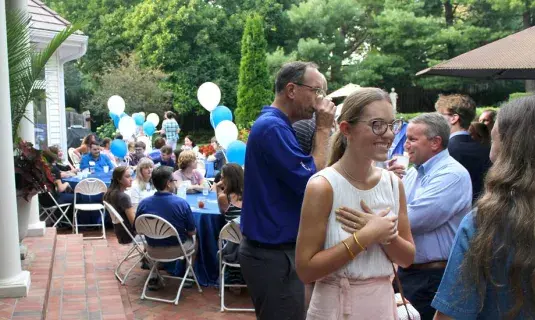 Parents with their children at family sendoff event.