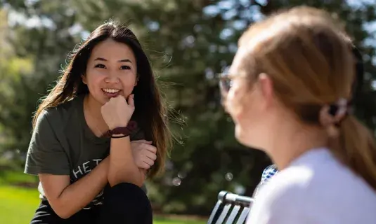 Happy students talking with each other