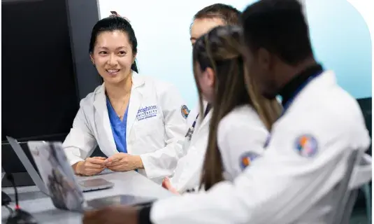 medical students listening to another student speaking