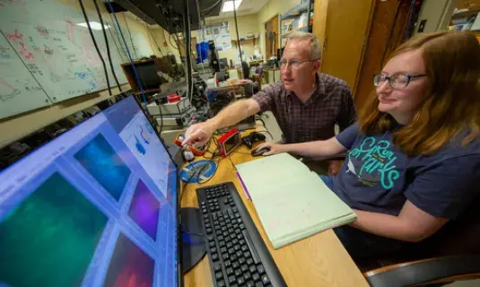 Dr. Nichols working with a research student