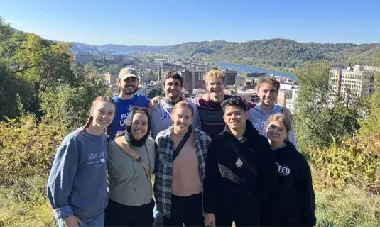Students posing in group shot on justice trip.