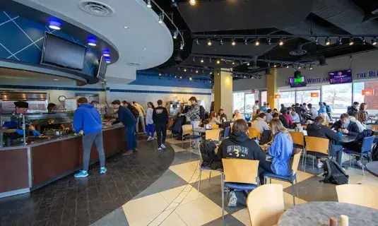 Brandeis dining center full of students eating.