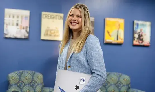 Alum smiling in the office.