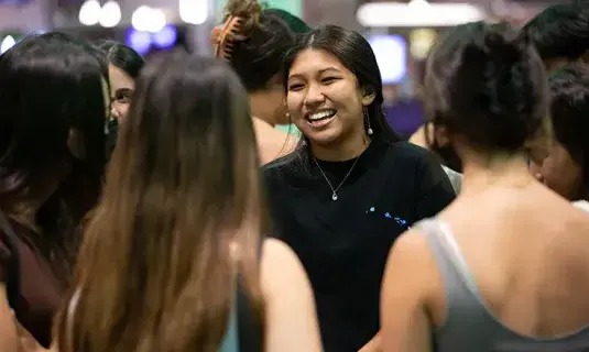 Students gathered and smiling in Students Union.