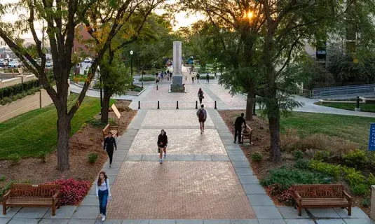 Wide view of campus mall at sunrise.