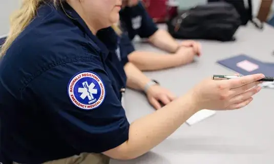 EMS workers at table.