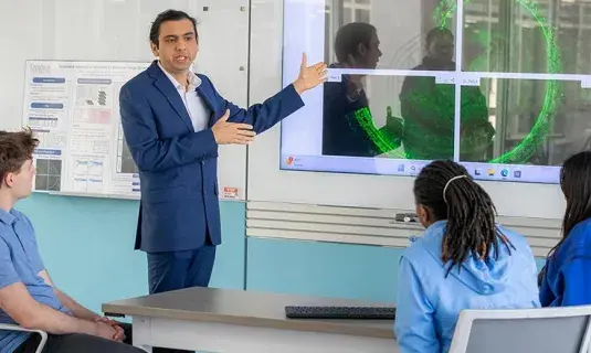 Dr. Fernandes presenting to students