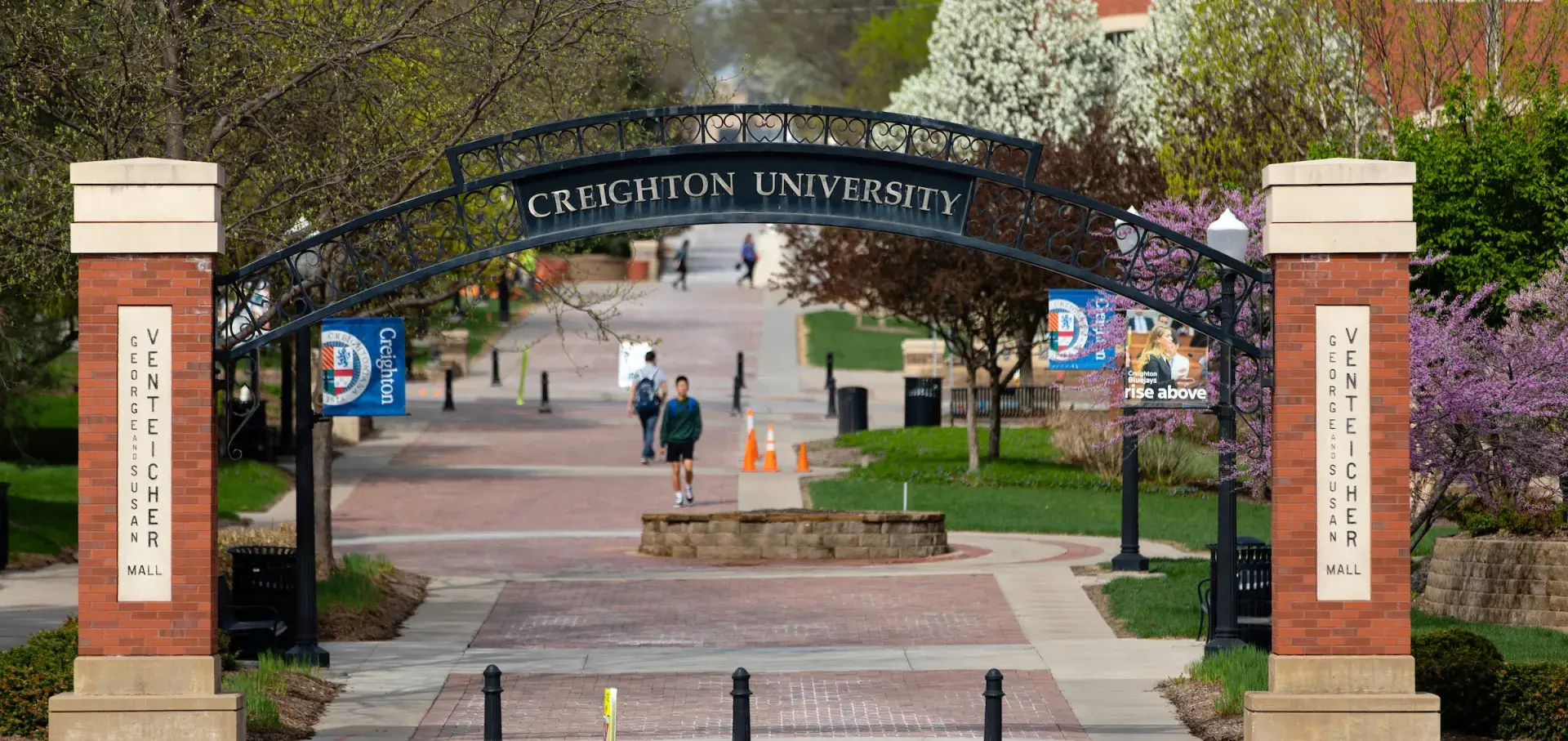 Creighton Arch with people walking