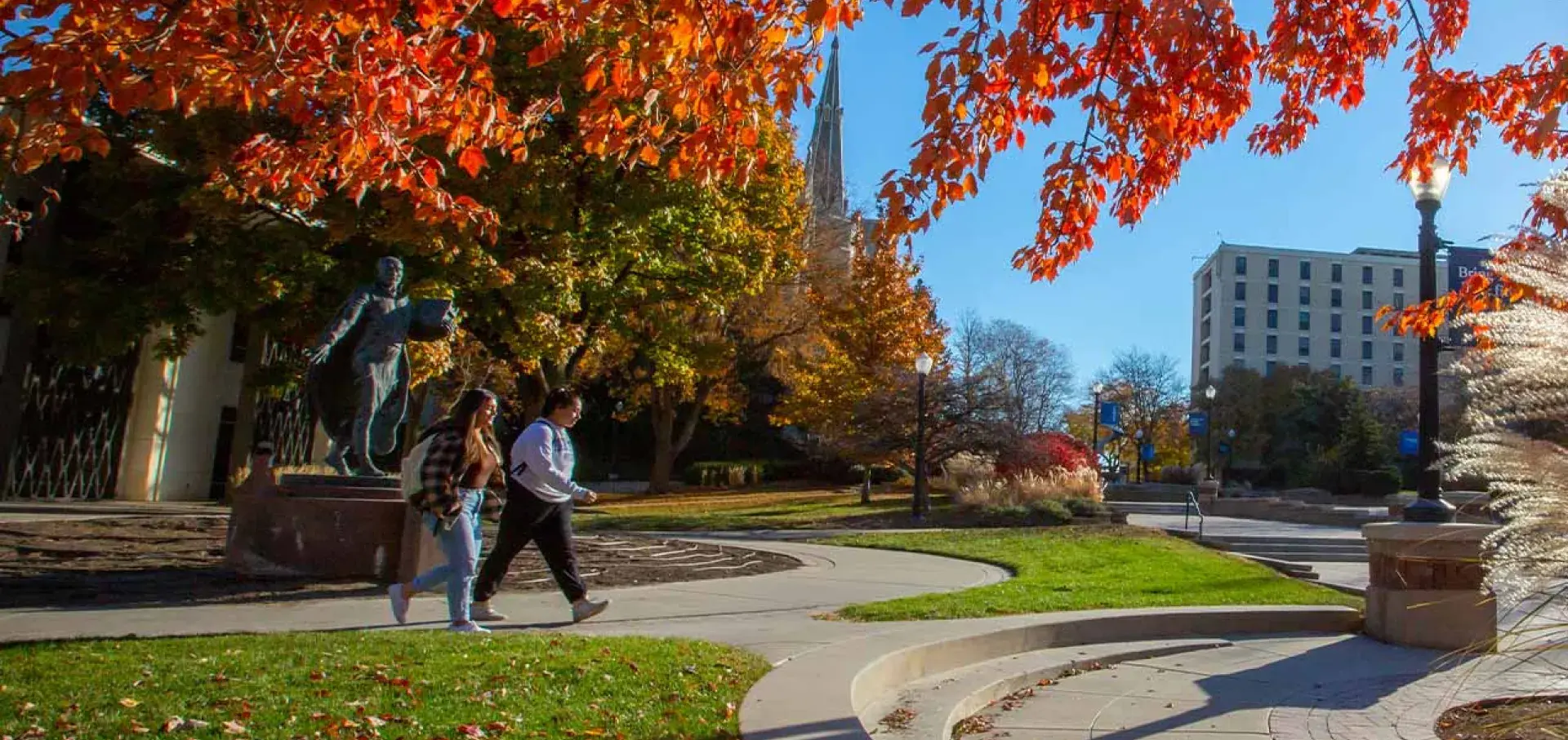 Fall foliage on Creighton's campus by the St. Ignatius statue