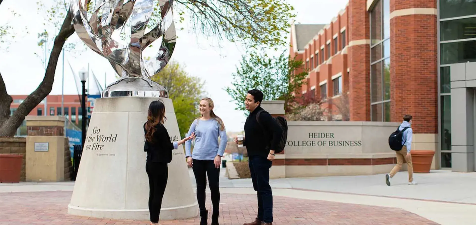 Students out front of the Heider College of Business