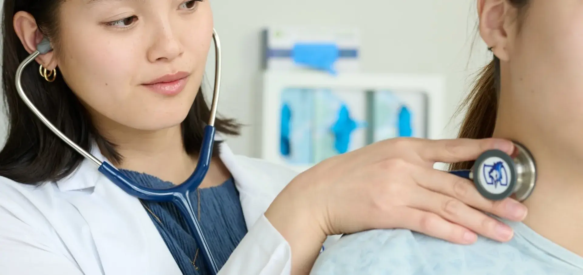 Nursing student with patient