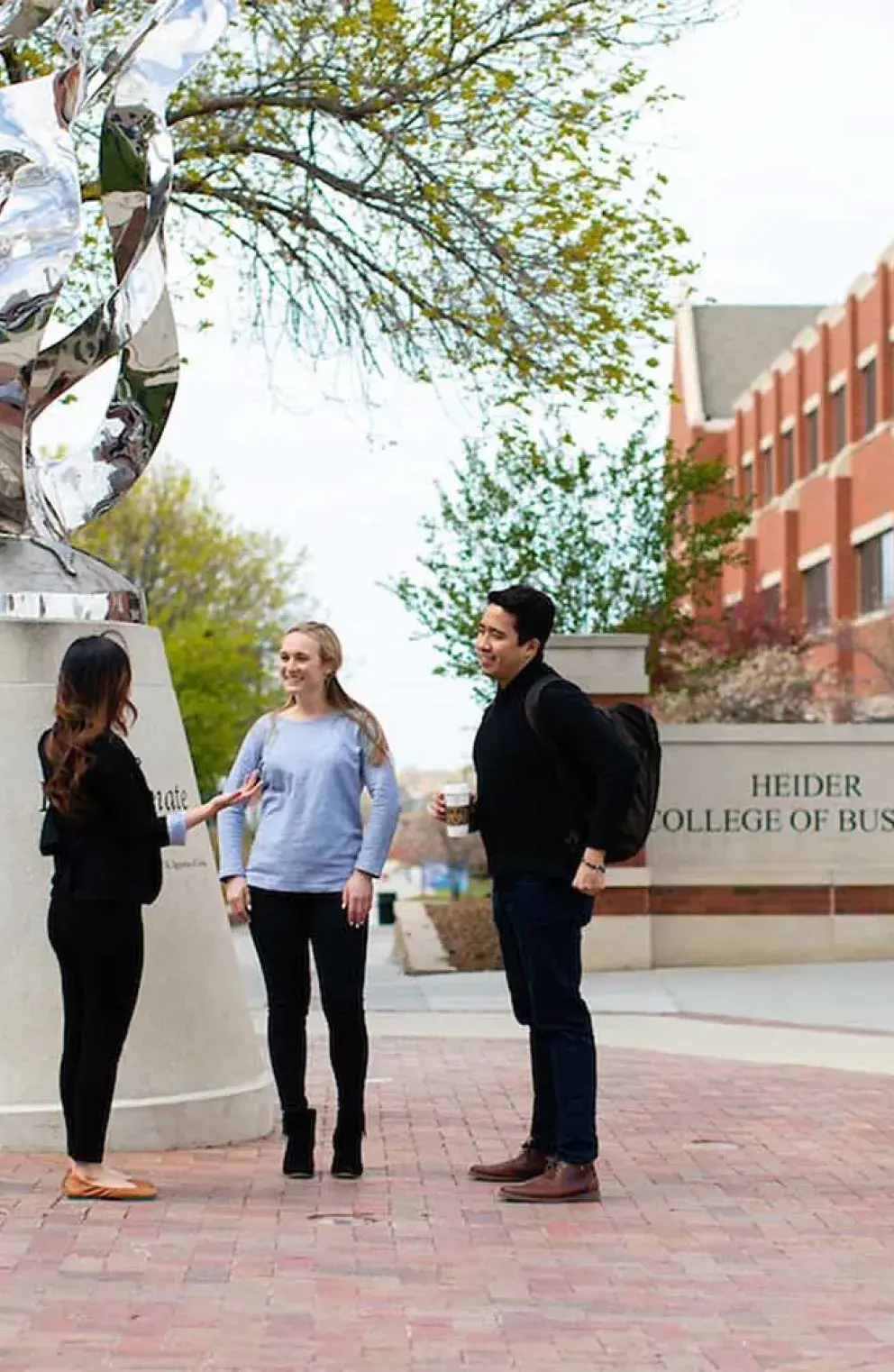 Students out front of the Heider College of Business