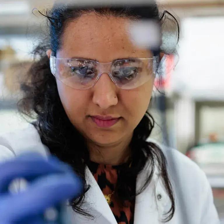 Woman at Creighton in research lab.